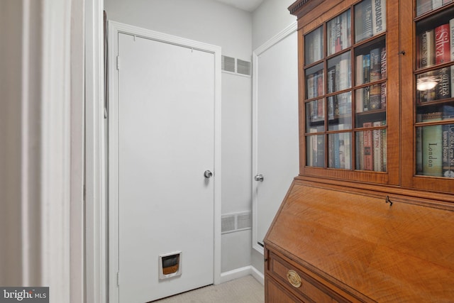 interior space featuring light colored carpet