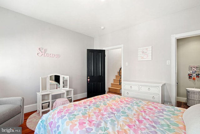 bedroom with hardwood / wood-style flooring