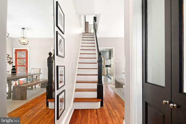 staircase featuring hardwood / wood-style flooring