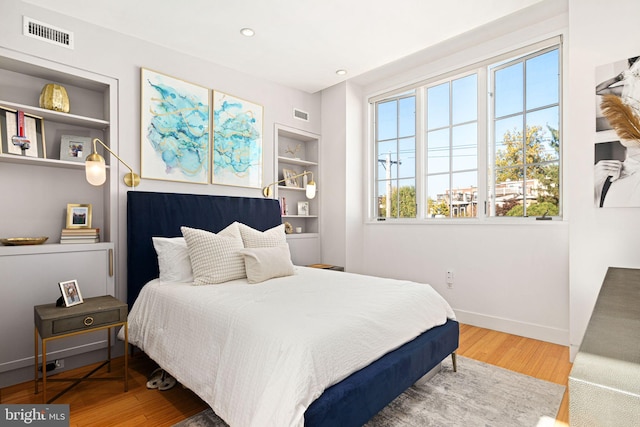 bedroom with wood-type flooring