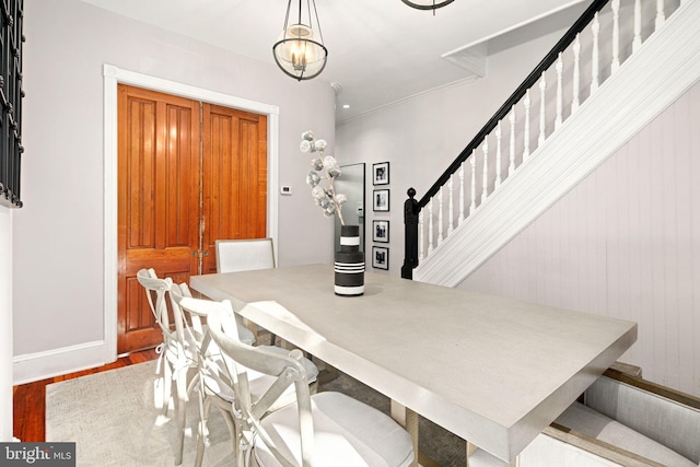 dining space with wood-type flooring