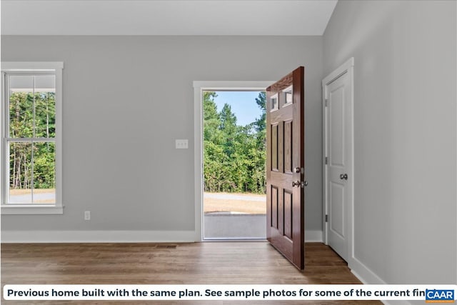 entryway with light hardwood / wood-style flooring and a healthy amount of sunlight