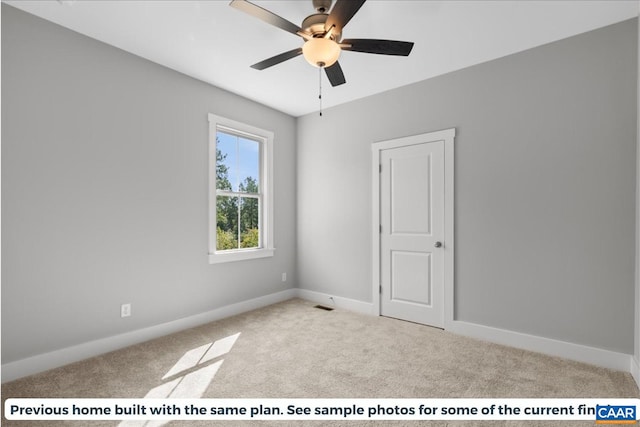 unfurnished room with ceiling fan and light colored carpet