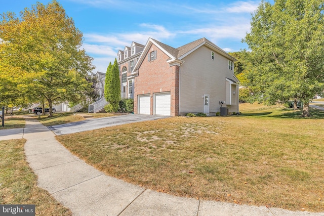 view of property exterior featuring a yard, a garage, and central air condition unit