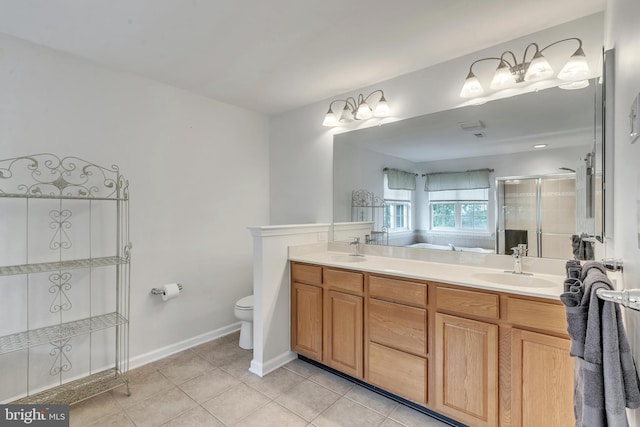 bathroom with tile patterned flooring, toilet, an enclosed shower, and vanity