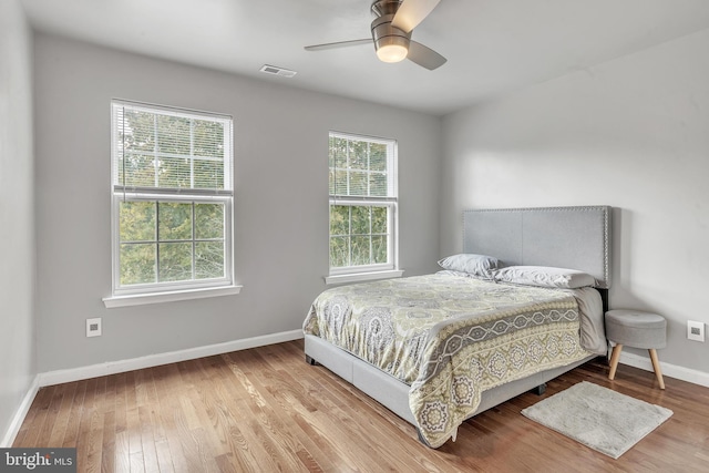 bedroom with hardwood / wood-style floors and ceiling fan