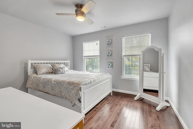 bedroom featuring ceiling fan and dark hardwood / wood-style flooring