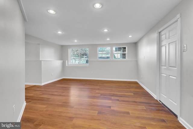 spare room with hardwood / wood-style floors