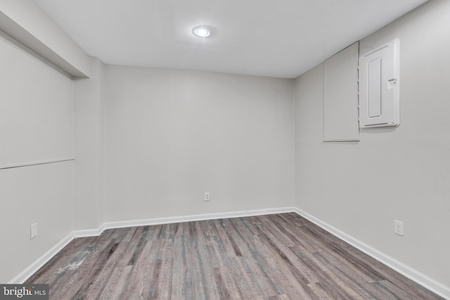 interior space with hardwood / wood-style flooring and electric panel