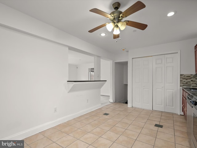 interior space featuring ceiling fan and light tile patterned floors