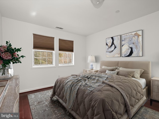 bedroom featuring dark wood-type flooring