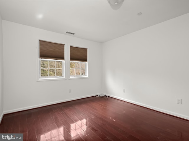 empty room featuring wood-type flooring