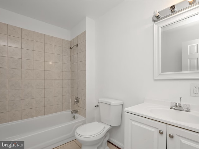 full bathroom with tiled shower / bath combo, vanity, tile patterned floors, and toilet