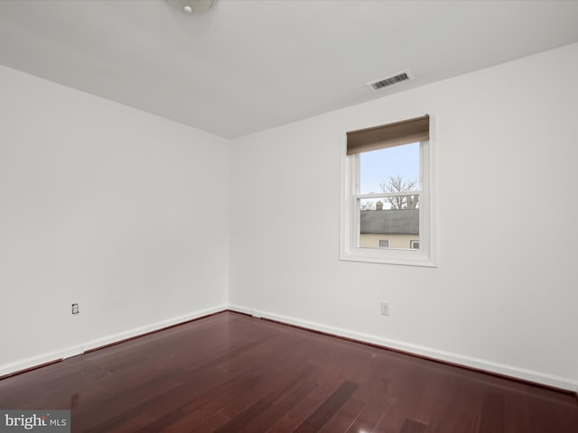 unfurnished room featuring hardwood / wood-style flooring