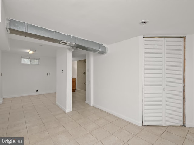 basement with light tile patterned floors