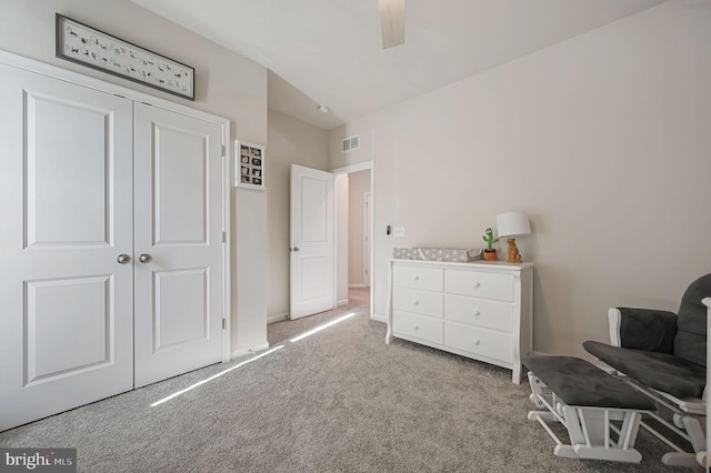 unfurnished room featuring light colored carpet and ceiling fan