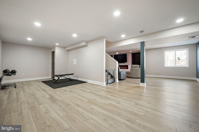 exercise area featuring light wood-type flooring