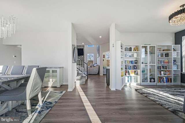 foyer featuring dark hardwood / wood-style flooring and a chandelier