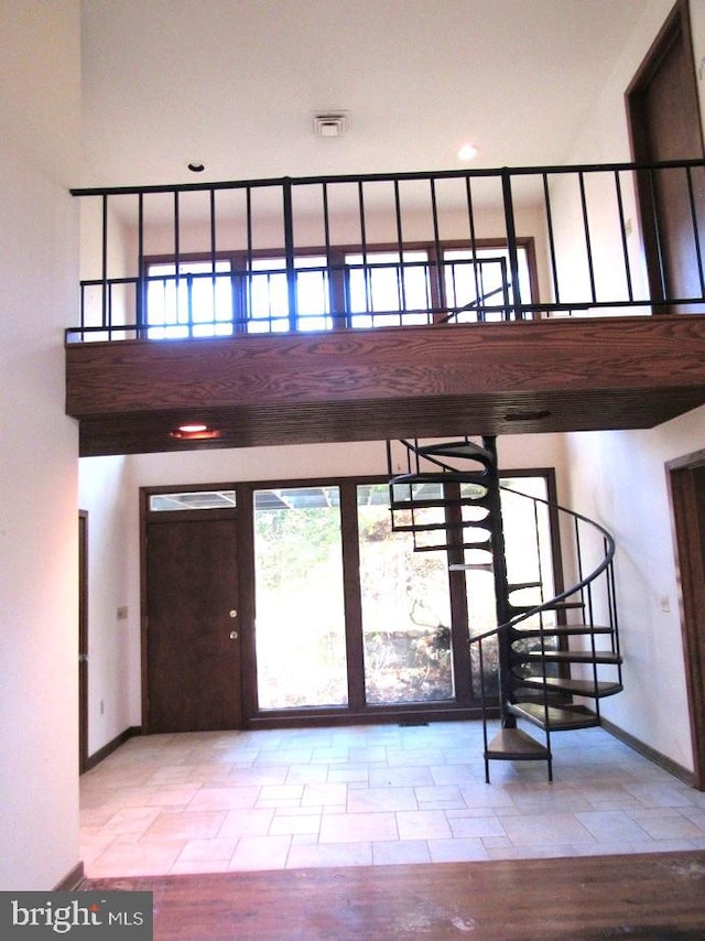 entryway featuring a high ceiling