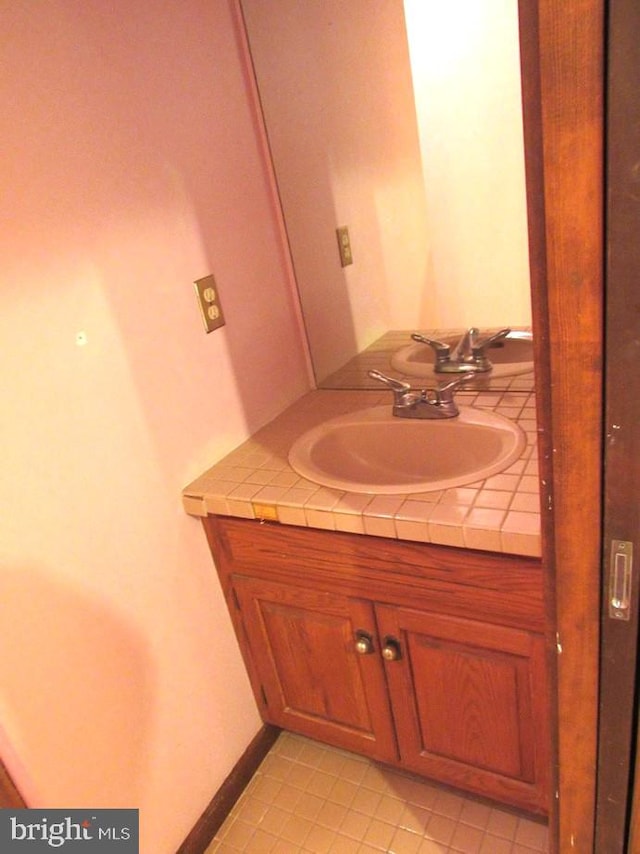 bathroom with vanity and tile patterned floors