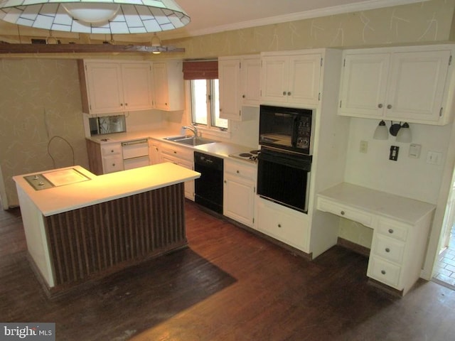 kitchen featuring sink, dark wood-type flooring, crown molding, white cabinets, and black appliances