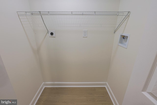 laundry room with hookup for an electric dryer, hookup for a washing machine, and hardwood / wood-style floors