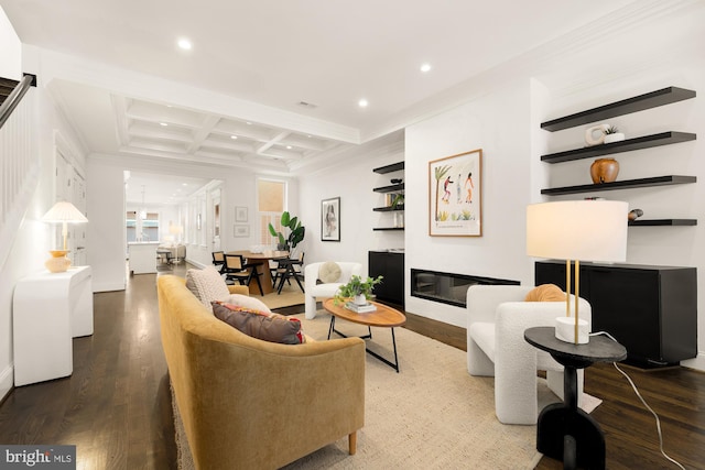 living room featuring hardwood / wood-style floors, beam ceiling, crown molding, and coffered ceiling