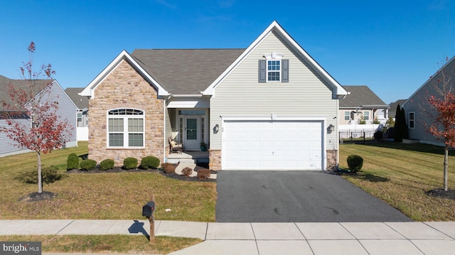 view of front of home with a garage and a front yard