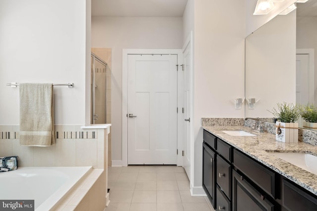 bathroom featuring vanity, separate shower and tub, and tile patterned floors