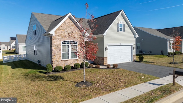 view of front property with a garage and a front lawn