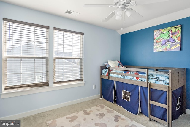 carpeted bedroom featuring ceiling fan and vaulted ceiling