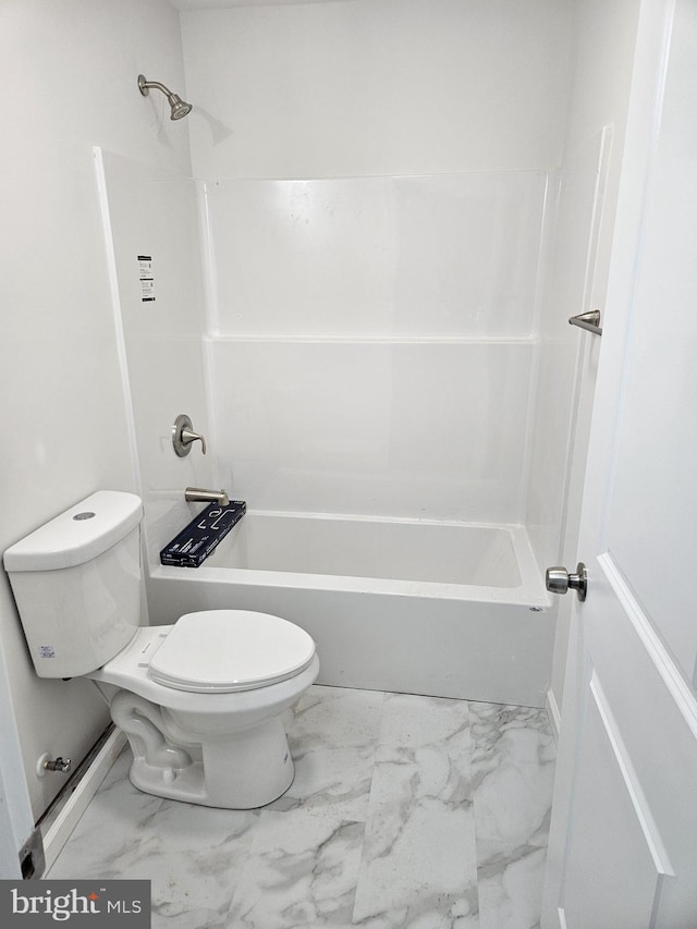 bathroom featuring marble finish floor and toilet