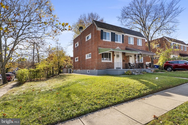 view of front of home featuring a front yard and central air condition unit