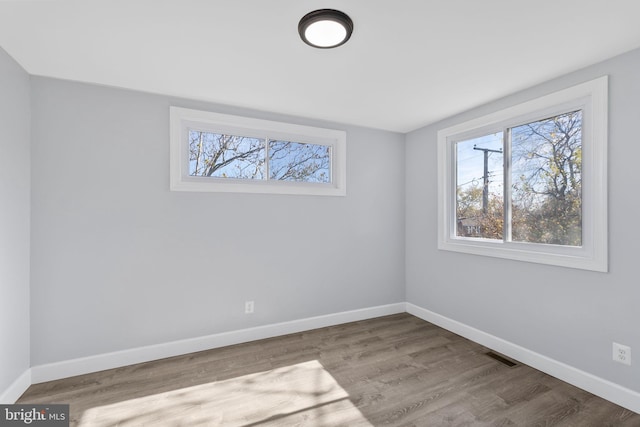 empty room featuring hardwood / wood-style flooring