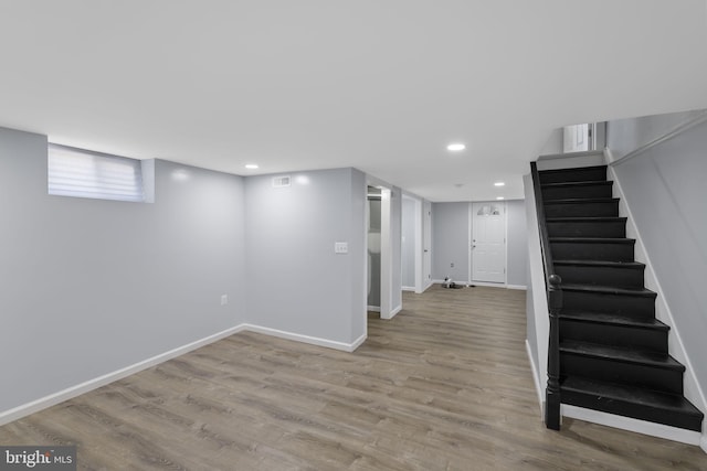 basement featuring light wood-type flooring