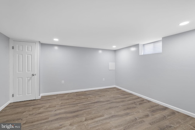 basement featuring hardwood / wood-style flooring