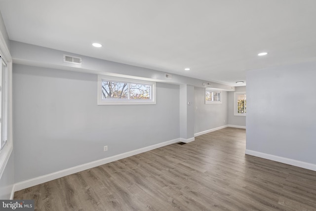 basement with hardwood / wood-style flooring