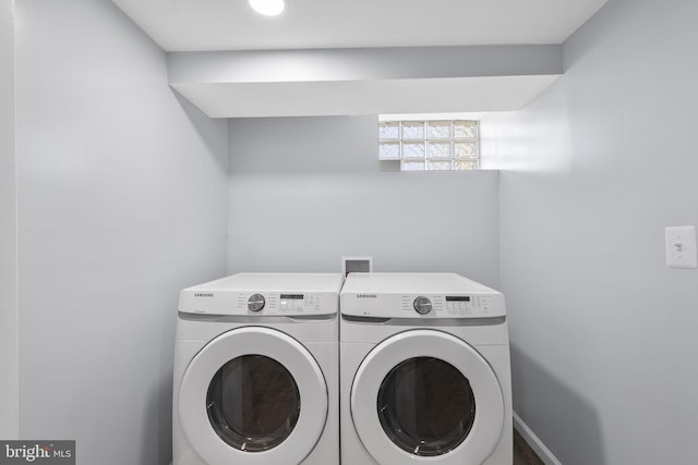 clothes washing area with independent washer and dryer