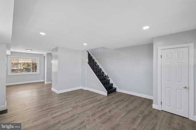 basement featuring wood-type flooring