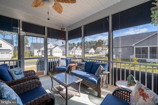 sunroom / solarium with ceiling fan