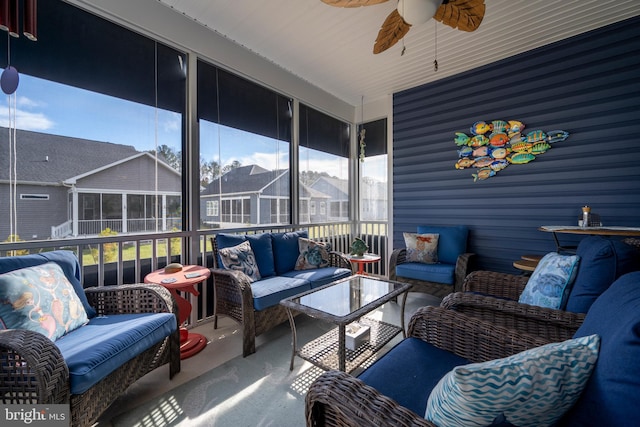 sunroom featuring ceiling fan