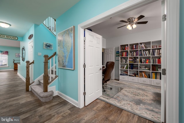 corridor with dark hardwood / wood-style floors