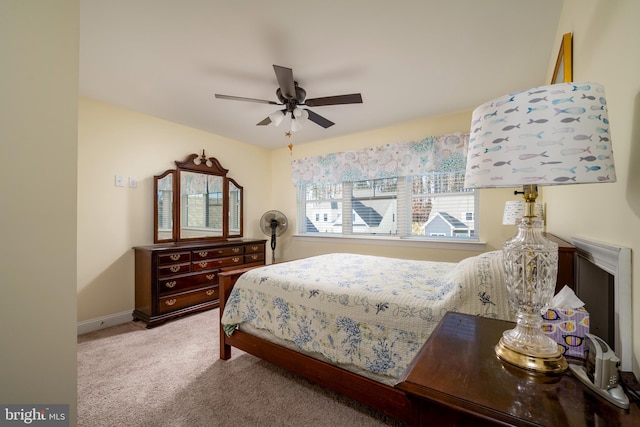 carpeted bedroom with ceiling fan