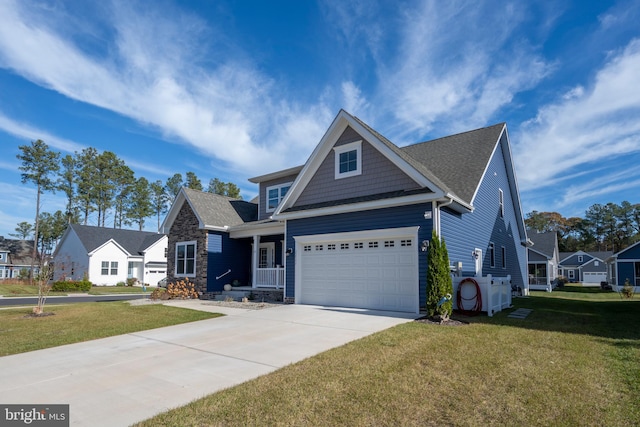 craftsman inspired home featuring a front lawn and a garage