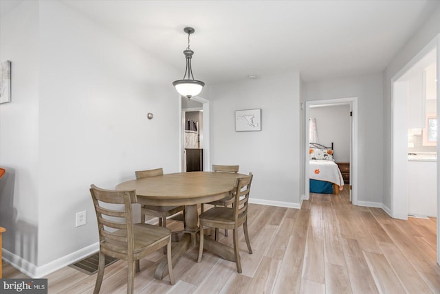 dining room with light hardwood / wood-style floors