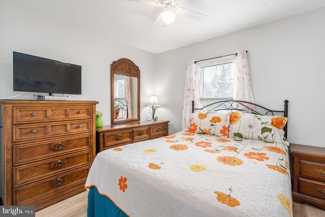 bedroom with ceiling fan and light hardwood / wood-style flooring