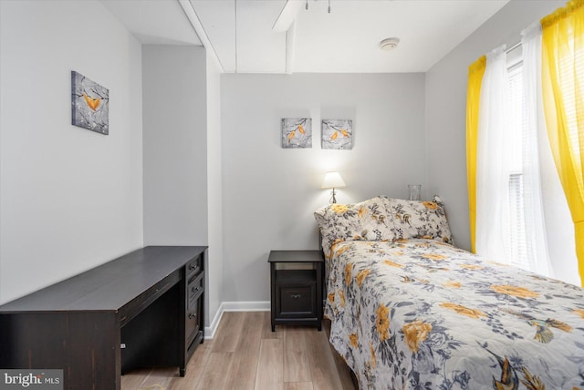 bedroom featuring ceiling fan and light wood-type flooring