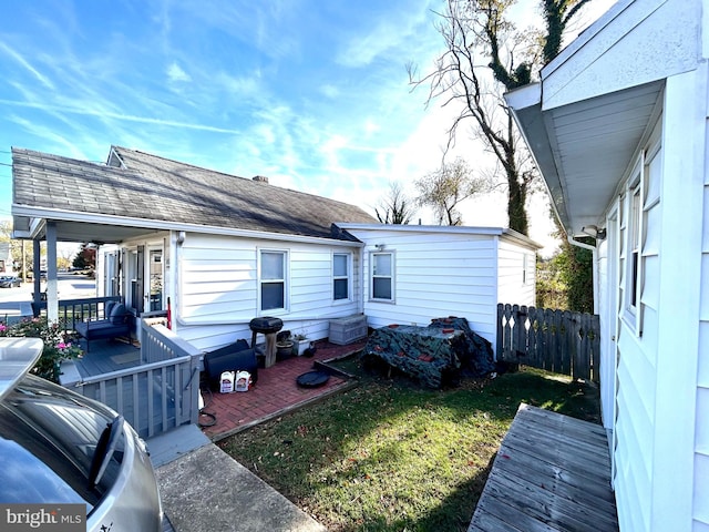 rear view of property with a lawn