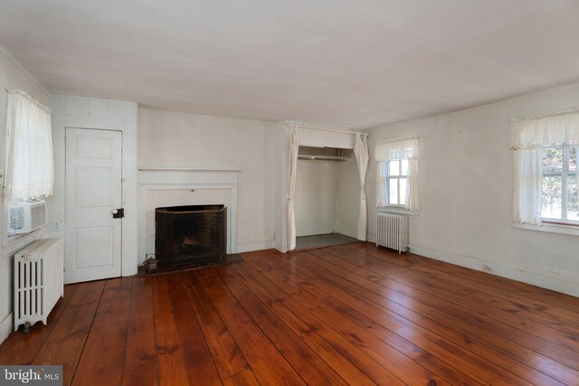 120 S Main St, Pennington, NJ 08534 - unfurnished living room with radiator, a fireplace with raised hearth, and plenty of natural light