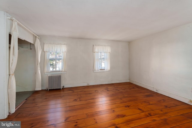 120 S Main St, Pennington, NJ 08534 - unfurnished room with radiator heating unit and hardwood / wood-style floors